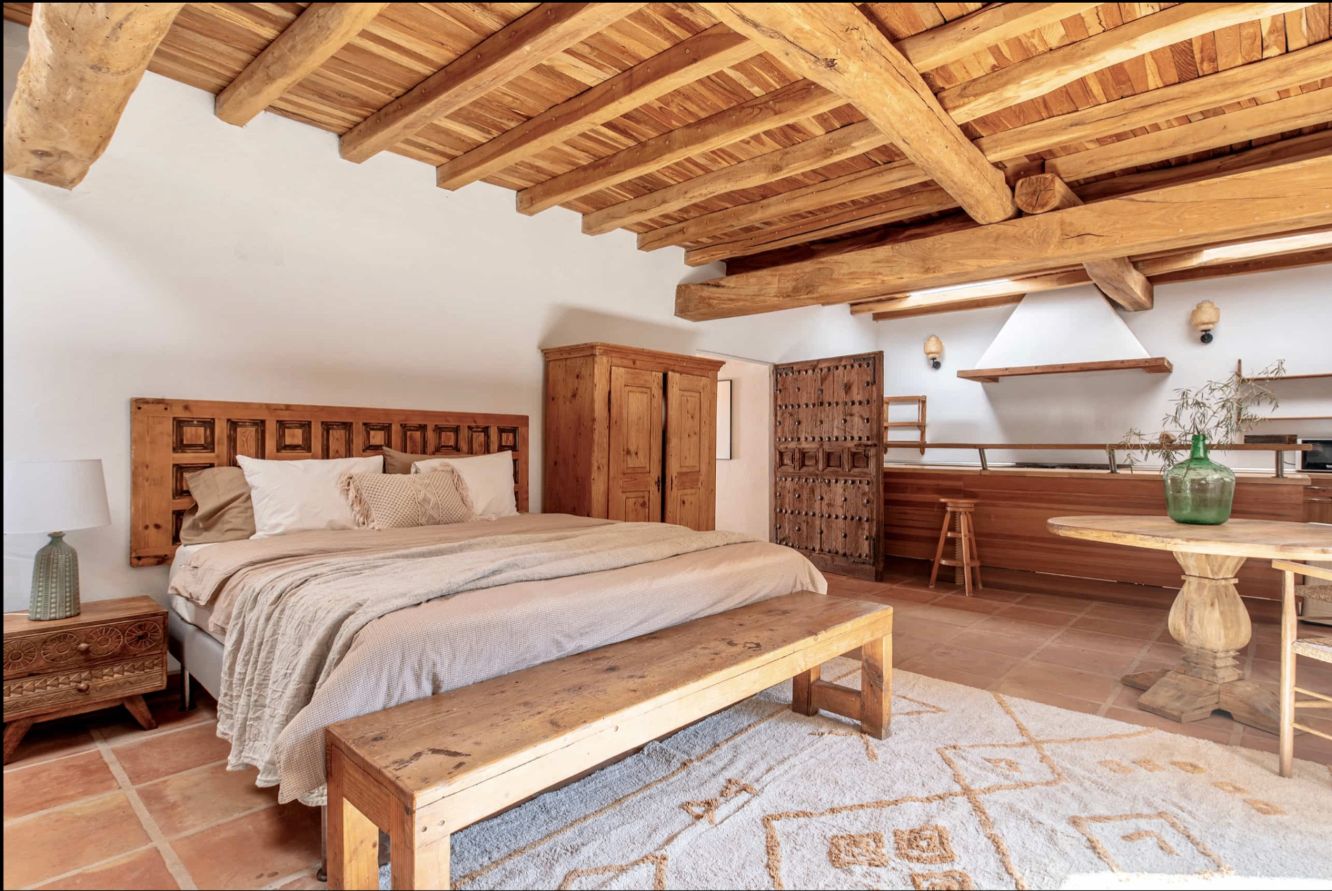 Bedroom with carved wooden headboard