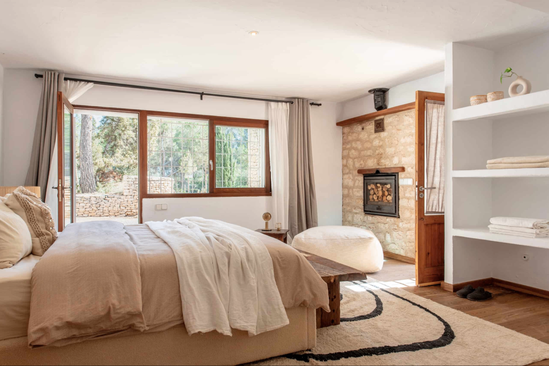 Bedroom with stone fireplace
