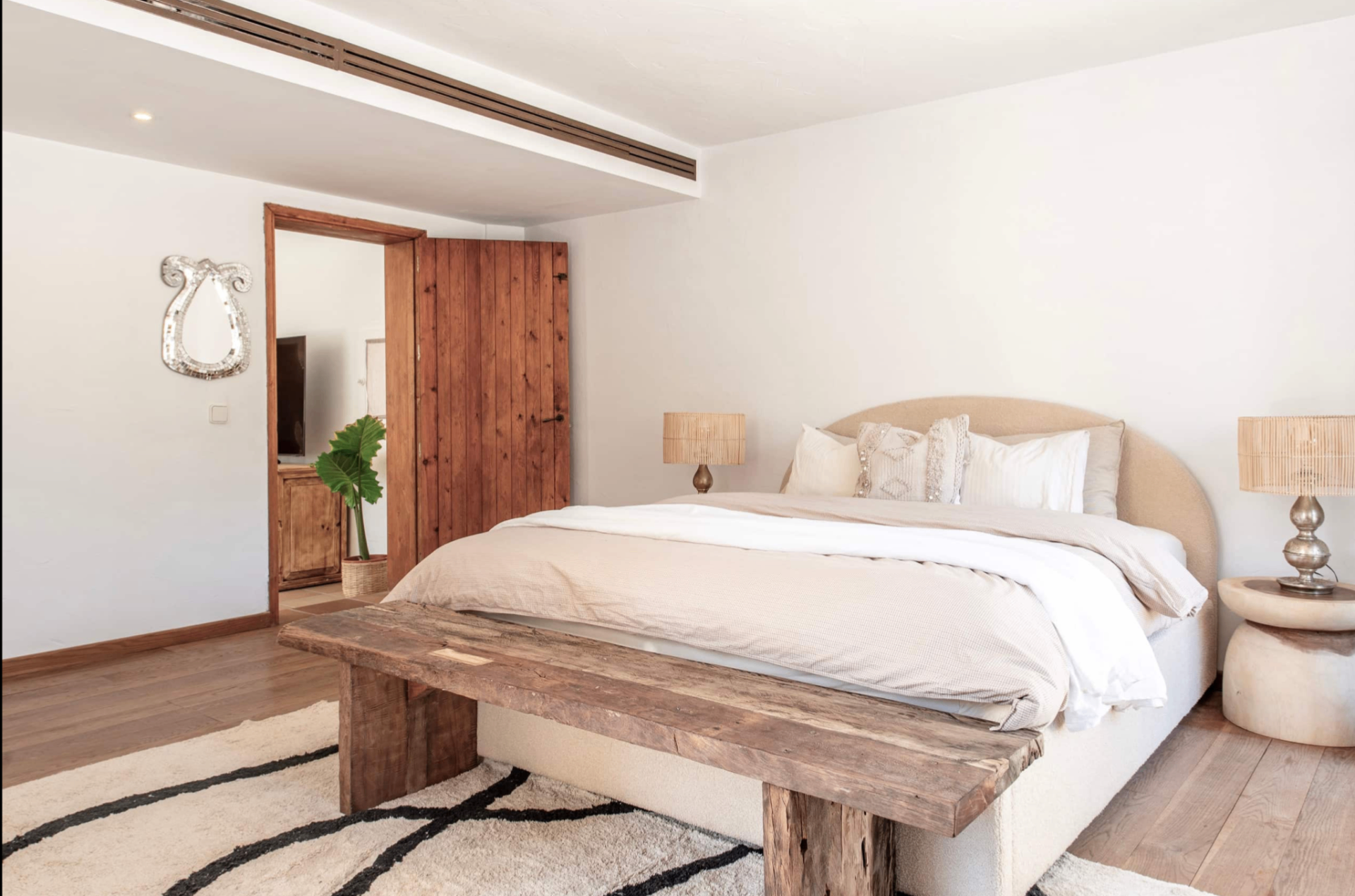 Spacious bedroom with timber bench