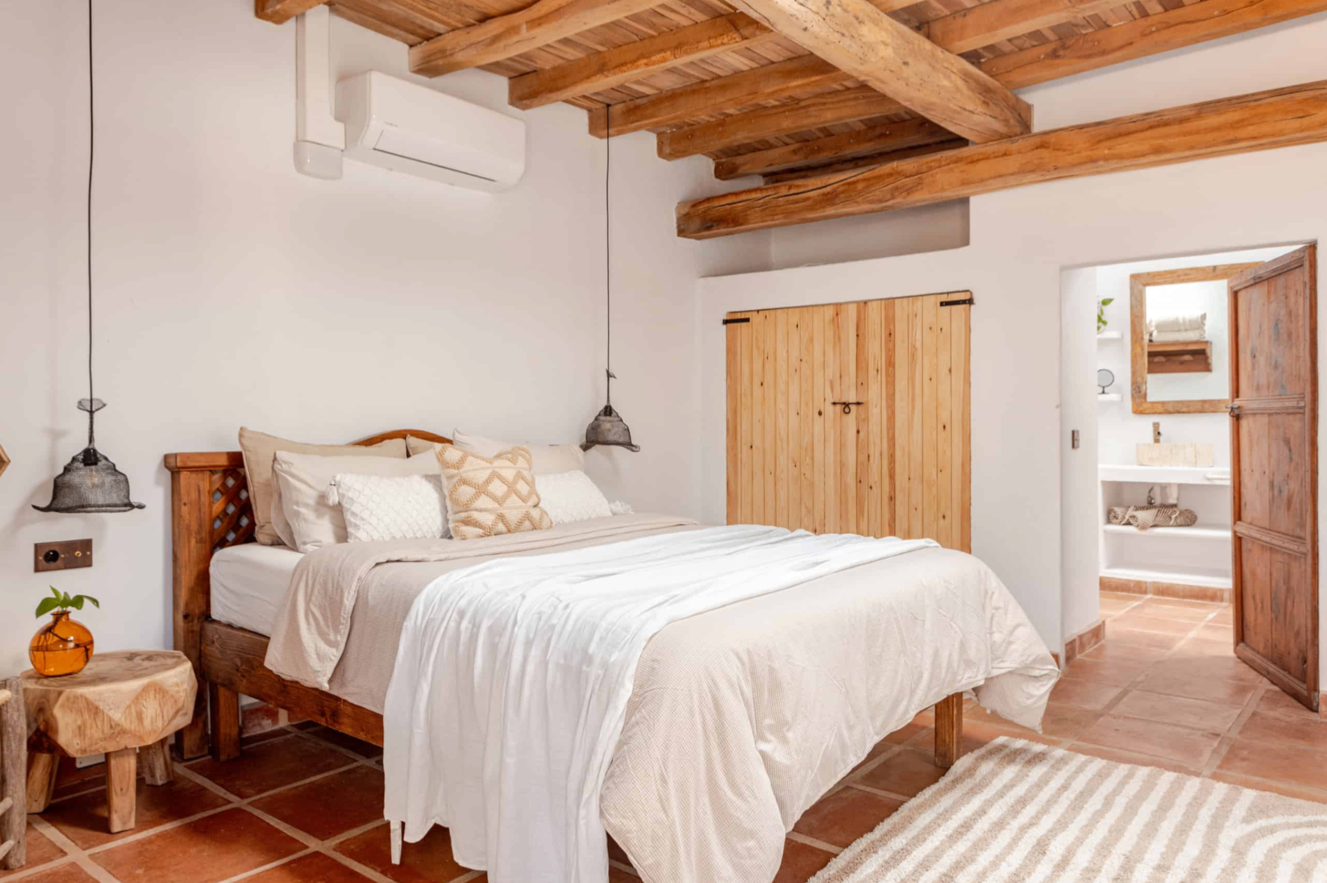Bedroom with timber ceiling and wardrobe