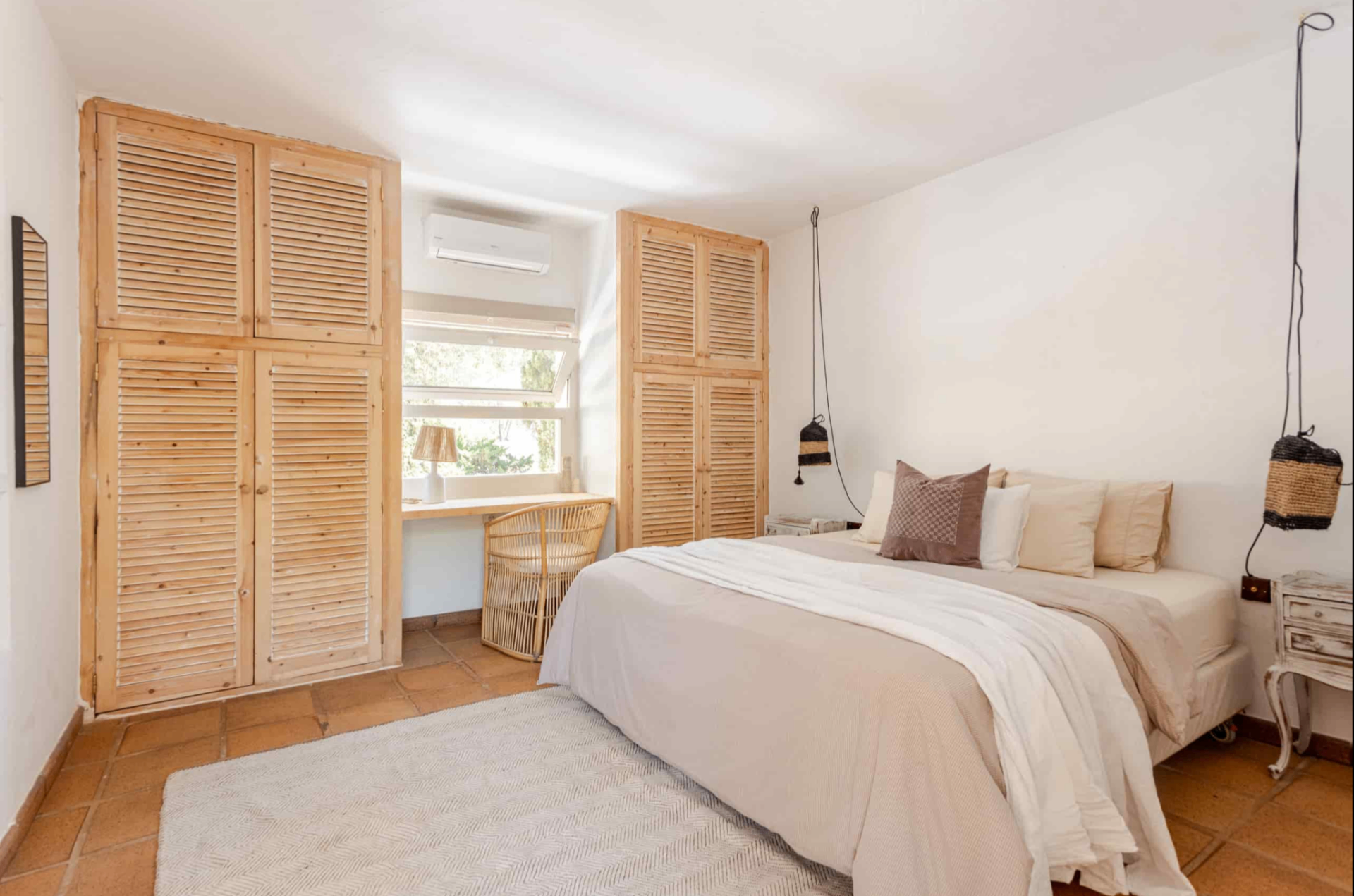 Bedroom with louvered wardrobes