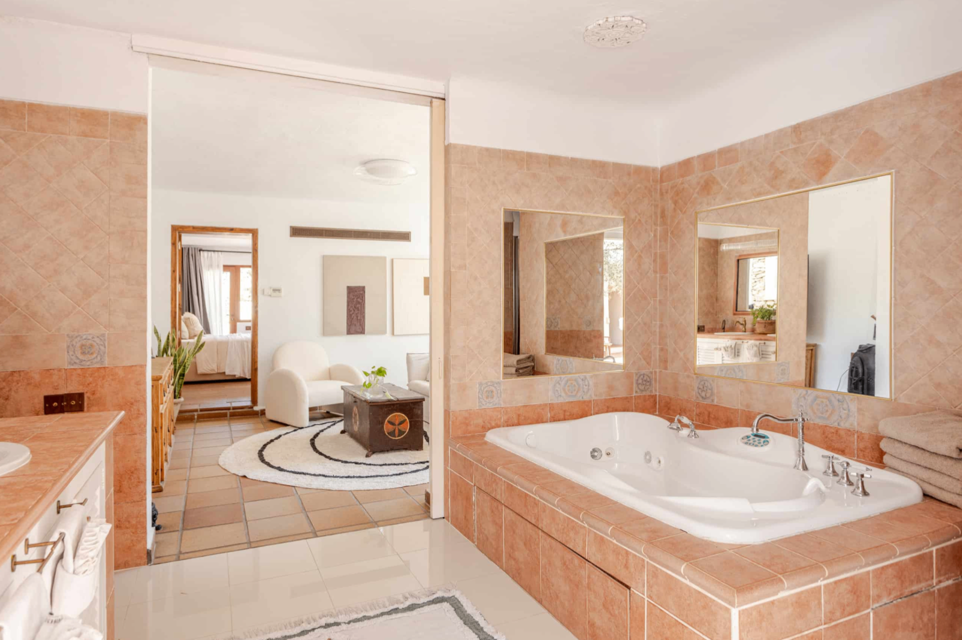 Bathroom with bathtub and dressing area