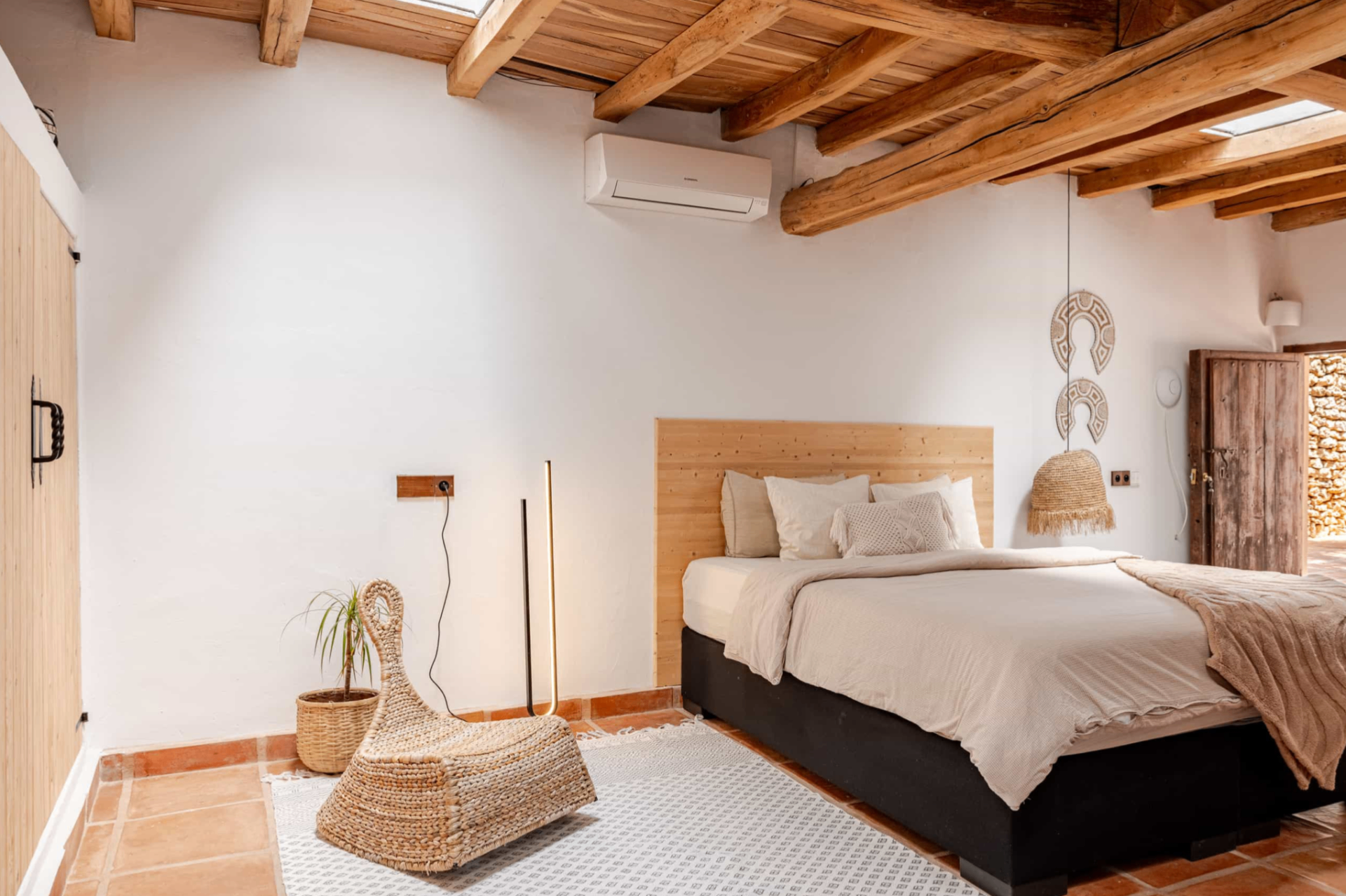 Bright bedroom with wooden headboard